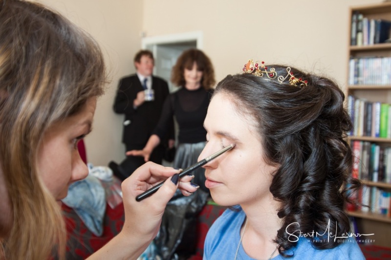 MUA applying eye shadow