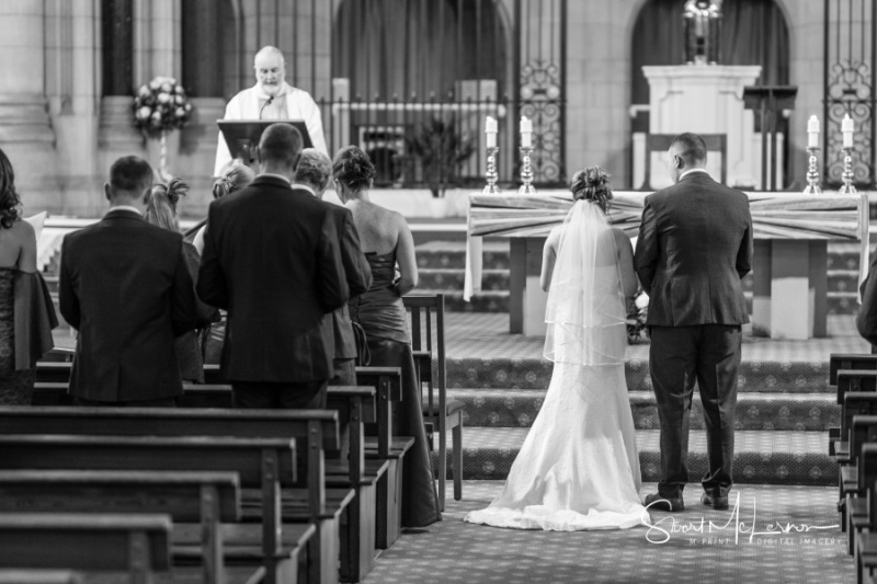 Bride and groom in front of the altar