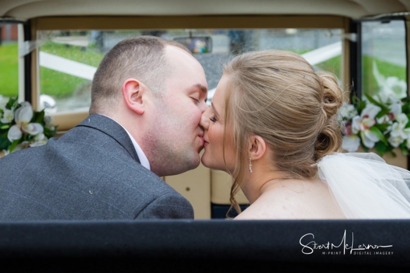 A kiss in the wedding car