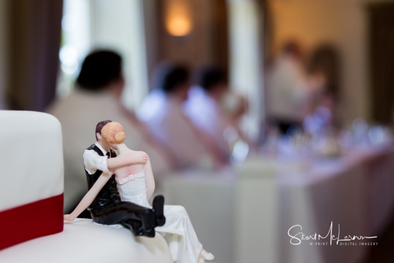 Bride and groom wedding cake topper