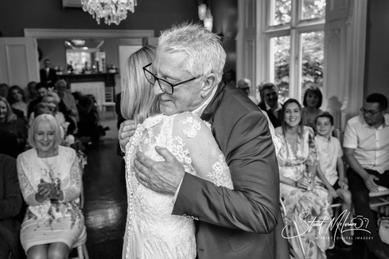 A hug for the newlyweds