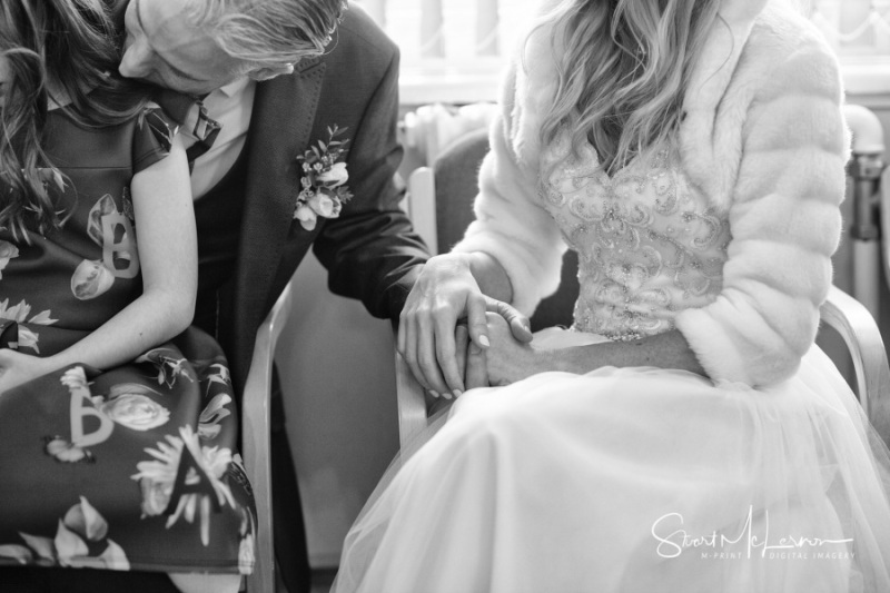 Bride and Groom holding hands at Stockport Town Hall