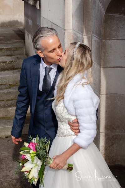 Bride and Groom kiss at Stockport Town Hall