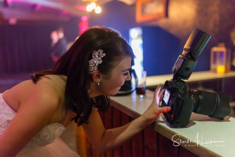 Bride looking at photographs