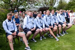 Groomsmen watching on