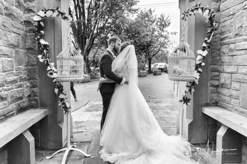 Bride and groom kiss