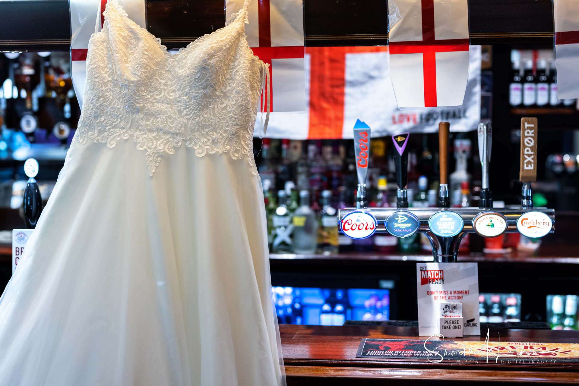 The Bride's dress in front of the bar