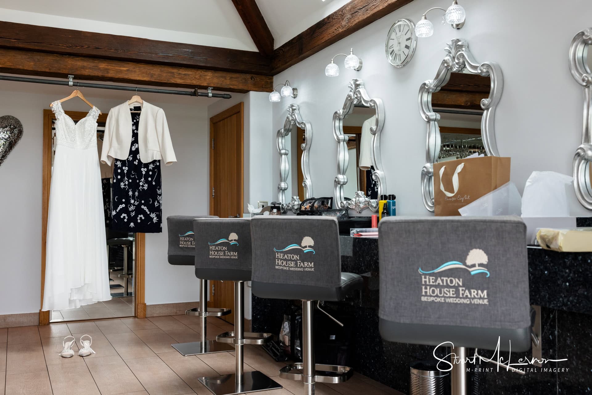 The bridal dress hangs ready in the prep room of Heaton House Farm