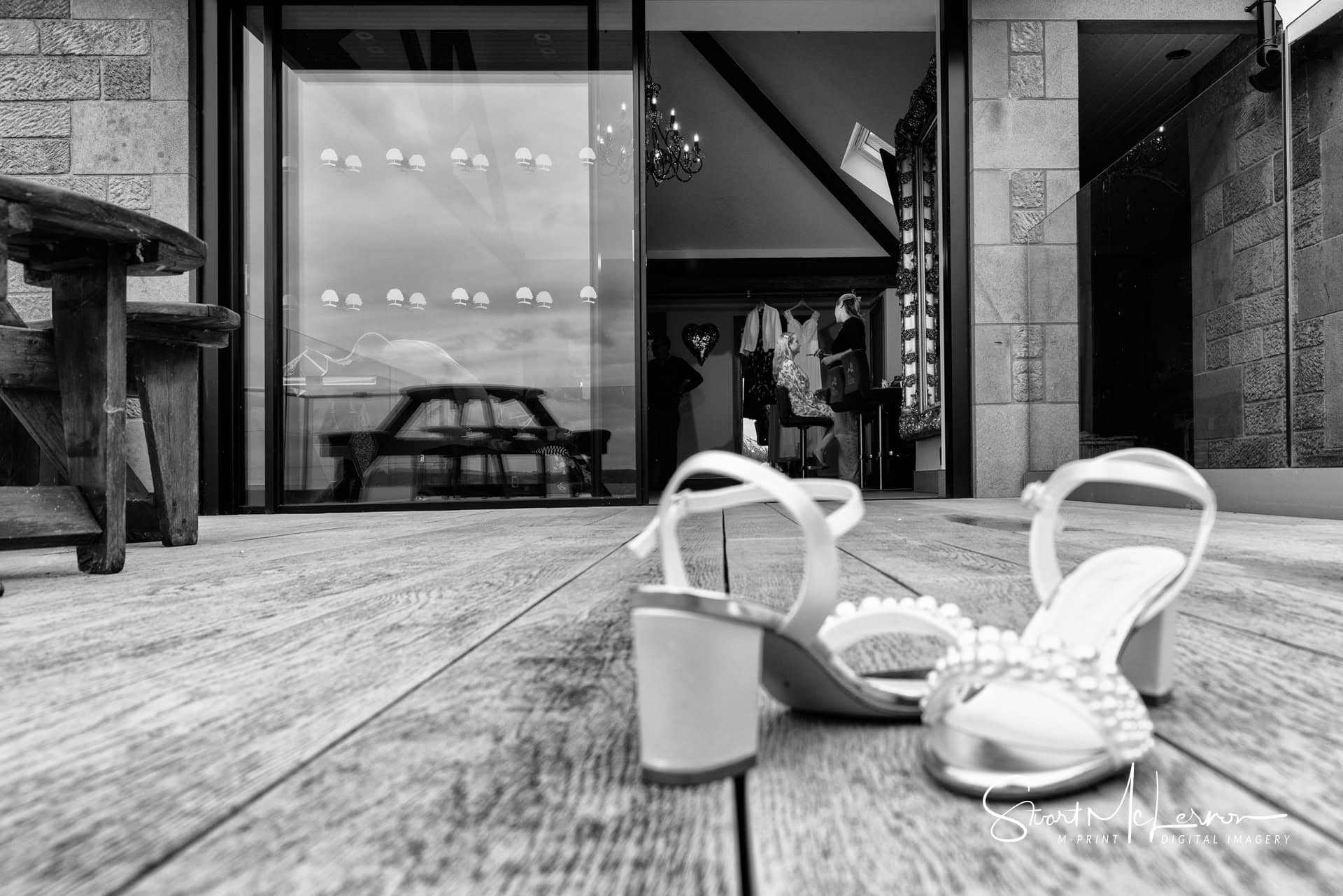 The bridal shoes on the decking outside the prep room at Heaton House Farm
