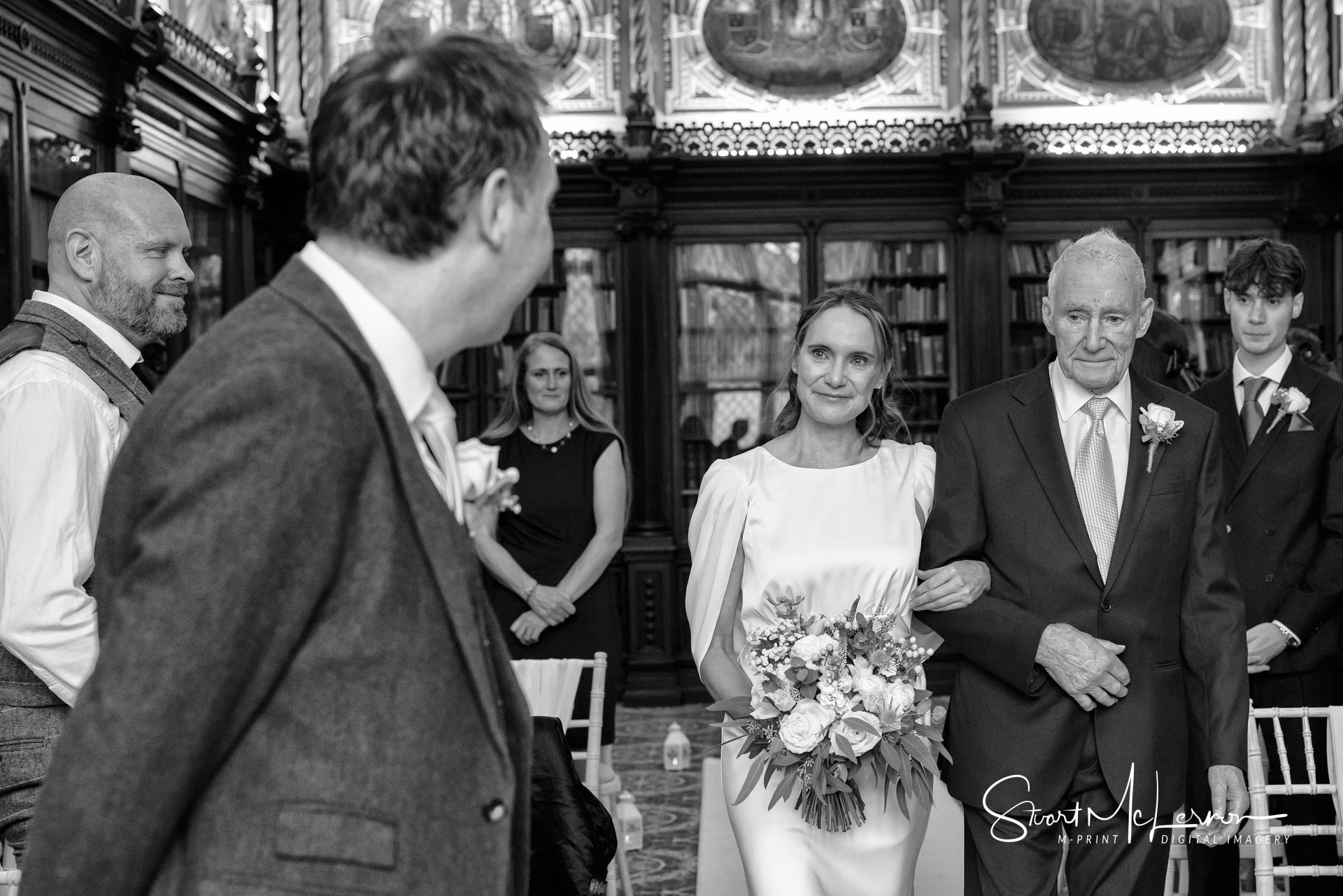 The bride-to-be smiles as she greets her groom before their wedding ceremony at Crewe Hall